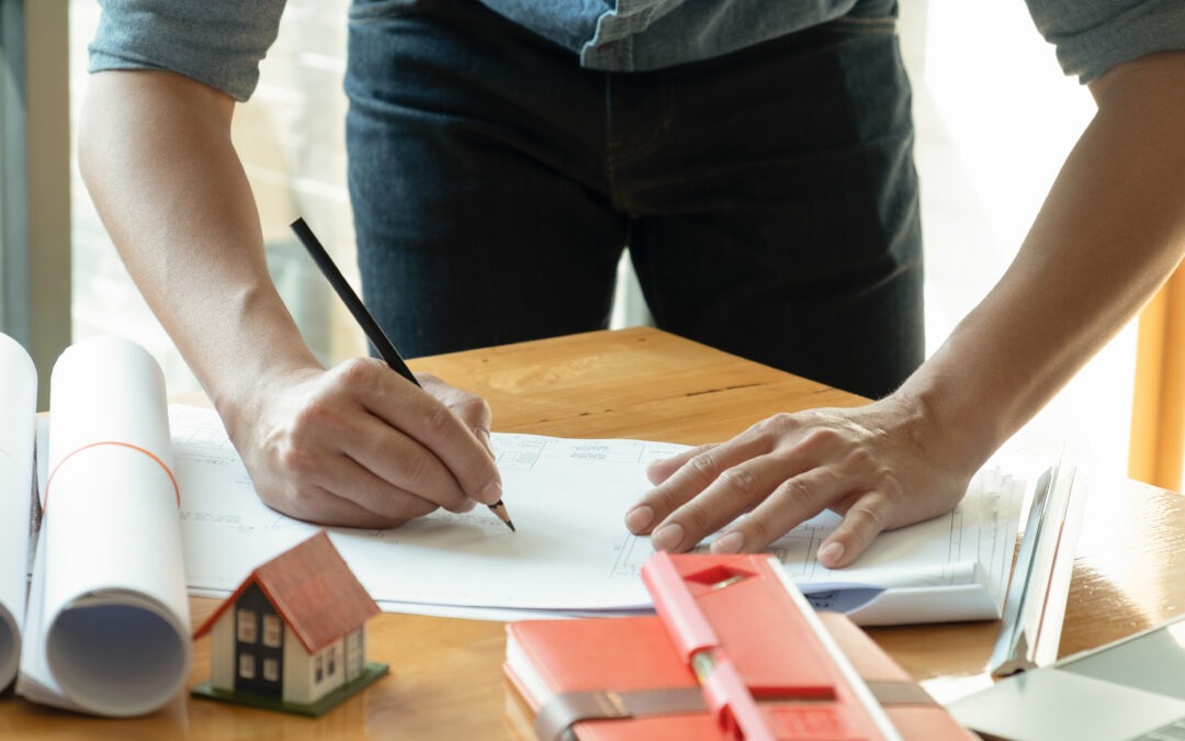 Architects write home designs on the desk.